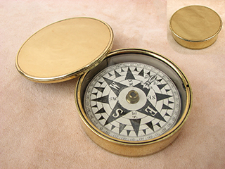 Early Victorian brass cased pocket compass with floating dial.